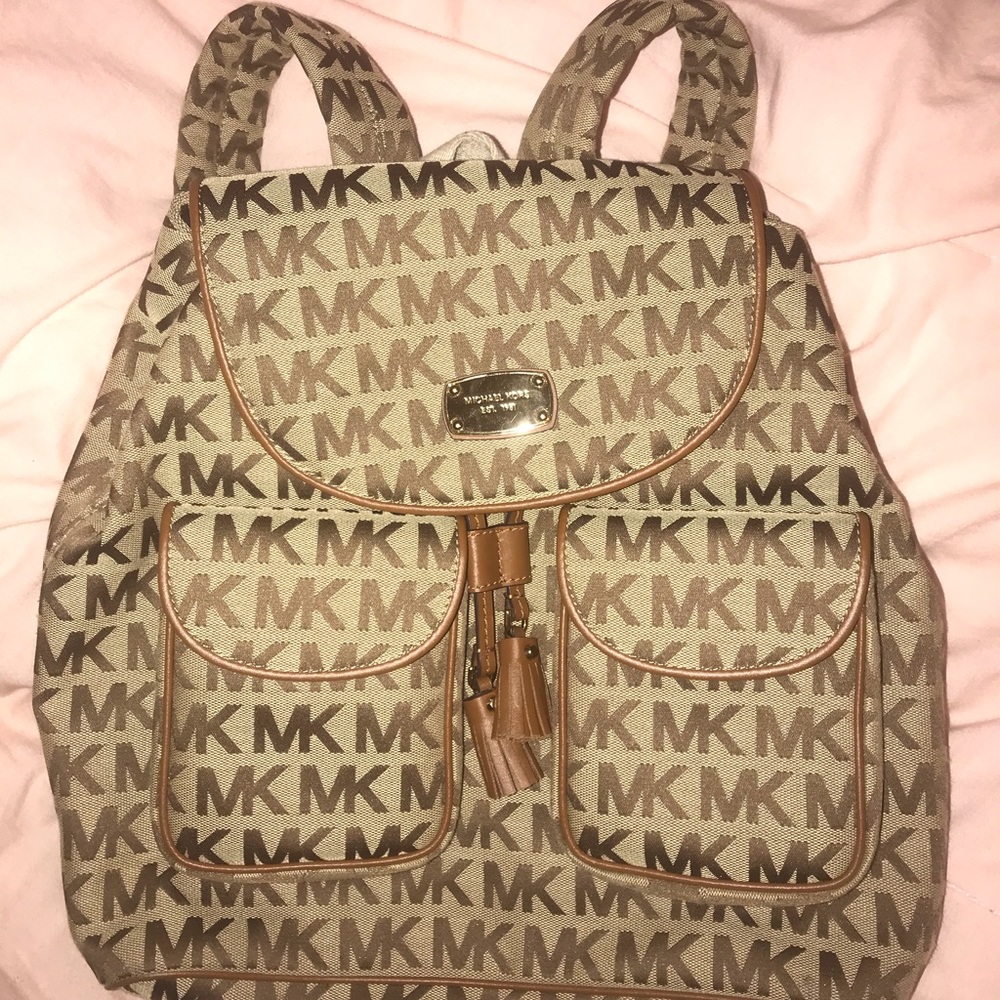 Michael Kors small/medium sized like new backpack